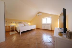 Posteľ alebo postele v izbe v ubytovaní Apartments Villa Marnii + 37 fotografií