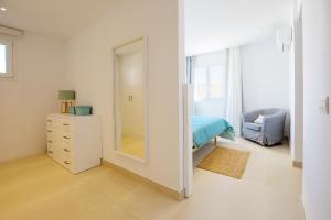 Łóżko lub łóżka w pokoju w obiekcie Villa Menorca 16