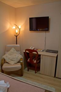 TV o dispositivi per l'intrattenimento presso Garni Hotel Tri O