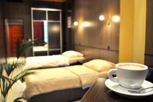 Postel nebo postele na pokoji v ubytování Hotel Fortuna