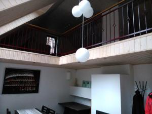 a room with a staircase and a table and chairs at Pullijärve Holiday Park in Misso