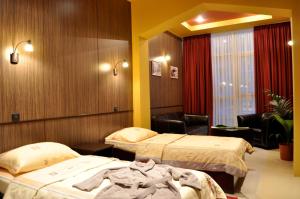 Postel nebo postele na pokoji v ubytování Hotel Fortuna