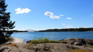 a large body of water with a bridge in the background at Värmdö Ängsv. in Djurhamn