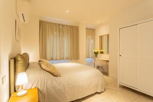 a bedroom with a bed and a desk in it at Your Private Harbour on Lake Como by Rent All Como in Laglio