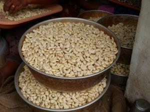 a large bowl of nuts sitting on top of other foods at Munroe Coconut Homestay in Munroe Island +89 photos