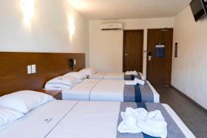 Postel nebo postele na pokoji v ubytování Hotel Star