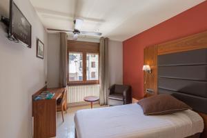 Posteľ alebo postele v izbe v ubytovaní Hotel Restaurant Castellarnau