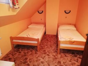 Postel nebo postele na pokoji v ubytování Pension Vladimír