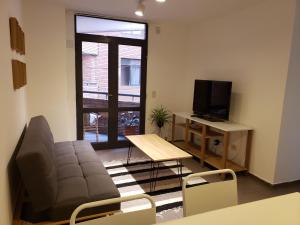 a living room with a couch and a television at Alquiler Temporario en Nueva Córdoba! in Córdoba