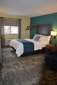 Un pat sau paturi într-o cameră la I M Hotel by Timberlake