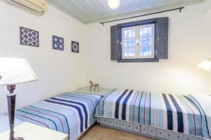 A bed or beds in a room at Villa Scirocco