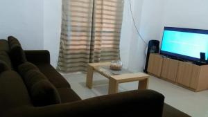 TV a/nebo společenská místnost v ubytování Rose's Getaway