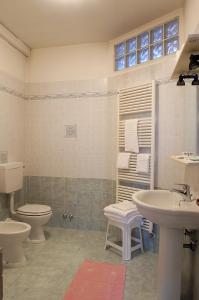 a bathroom with a toilet and a sink at Locanda Stella D'oro in Quinto di Treviso