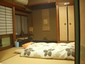 guest house AN tesisinde bir odada yatak veya yataklar