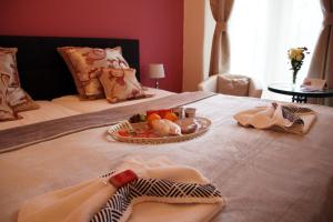 a tray of food on top of a bed at Penzion Alfa Poděbrady in Poděbrady