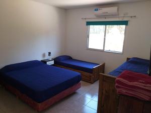 Ένα ή περισσότερα κρεβάτια σε δωμάτιο στο Casa quinta En Tortuguitas +14 φωτογραφίες