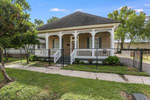 a house with a porch and a fence at 2 miles to Downtown EaDo House Jr in Houston