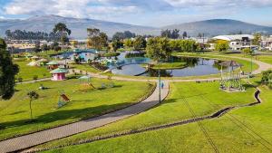 an aerial view of a park with a playground at Hospedaje San Fernando in Cayambe