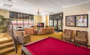 a billiard room with a pool table and chairs at WorldMark Seattle - The Camlin in Seattle