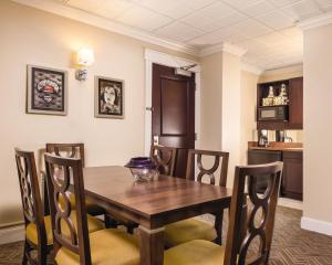 a dining room with a wooden table and chairs at WorldMark Seattle - The Camlin in Seattle