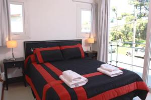 Una cama o camas en una habitación de Duplex Valeria Soho