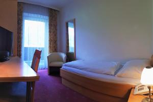 Posteľ alebo postele v izbe v ubytovaní Hotel Post
