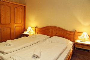 Letto o letti in una camera di Hotel Post