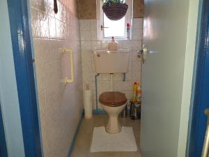 a small bathroom with a toilet and a sink at CEAD MILE FAILTE WEST BELFAST in Belfast