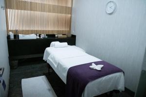 Postel nebo postele na pokoji v ubytování QUARTZ HOTEL & SPA