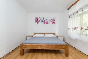 Posteľ alebo postele v izbe v ubytovaní Apartment Robinzon Lantana