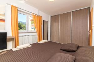 Posteľ alebo postele v izbe v ubytovaní Apartments Villa Adore + 37 fotografií