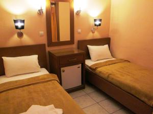 Postel nebo postele na pokoji v ubytování Hotel Lito