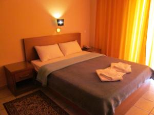 Postel nebo postele na pokoji v ubytování Hotel Lito