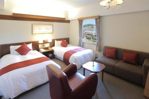 Postel nebo postele na pokoji v ubytování Kurashiki Kokusai Hotel