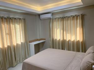 מיטה או מיטות בחדר ב-NatuCenter Hospedaje