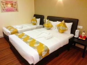 Postel nebo postele na pokoji v ubytování Hotel Sunjoy9 OKR