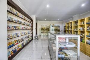 a pharmacy aisle with a display case in a store at RedDoorz near Condongcatur Bus Station in Yogyakarta