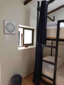 Voodi või voodid majutusasutuse Xplora Hostel Cusco toas
