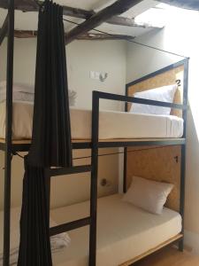 Voodi või voodid majutusasutuse Xplora Hostel Cusco toas