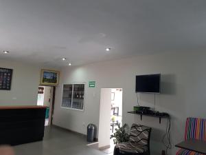 Televiisor ja/või meelelahutuskeskus majutusasutuses Xplora Hostel Cusco