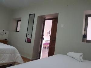 Voodi või voodid majutusasutuse Xplora Hostel Cusco toas