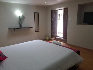 Voodi või voodid majutusasutuse Xplora Hostel Cusco toas