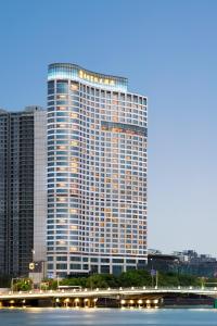 a large building with a view of the ocean at Shangri-La Ningbo - The Three Rivers Intersection in Ningbo