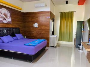 Ένα ή περισσότερα κρεβάτια σε δωμάτιο στο Nuwono Tasya Syariah