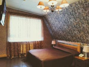 Mini Hotel Kedrovaya Pad tesisinde bir odada yatak veya yataklar