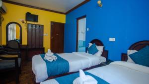 Katil atau katil-katil dalam bilik di Hotel Green Horizon