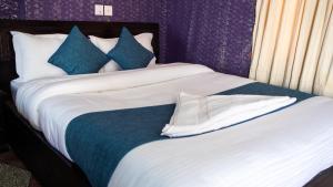 Katil atau katil-katil dalam bilik di Hotel Green Horizon