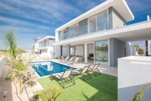 an image of a house with a swimming pool at Olivine Pearl Villas in Protaras