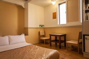 Ein Bett oder Betten in einem Zimmer der Unterkunft 真正好旅店 Good Hotel
