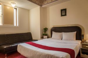 Ein Bett oder Betten in einem Zimmer der Unterkunft 真正好旅店 Good Hotel